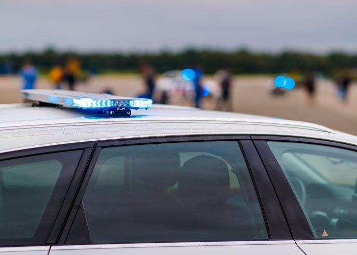 Roof-mounted blue light bar on a Dutch police car on the street The roof-mounted blue light bar on a Dutch police car on the street